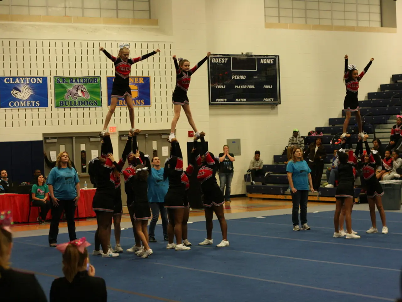 In this image there are people with different uniforms are present on the floor. Image also...