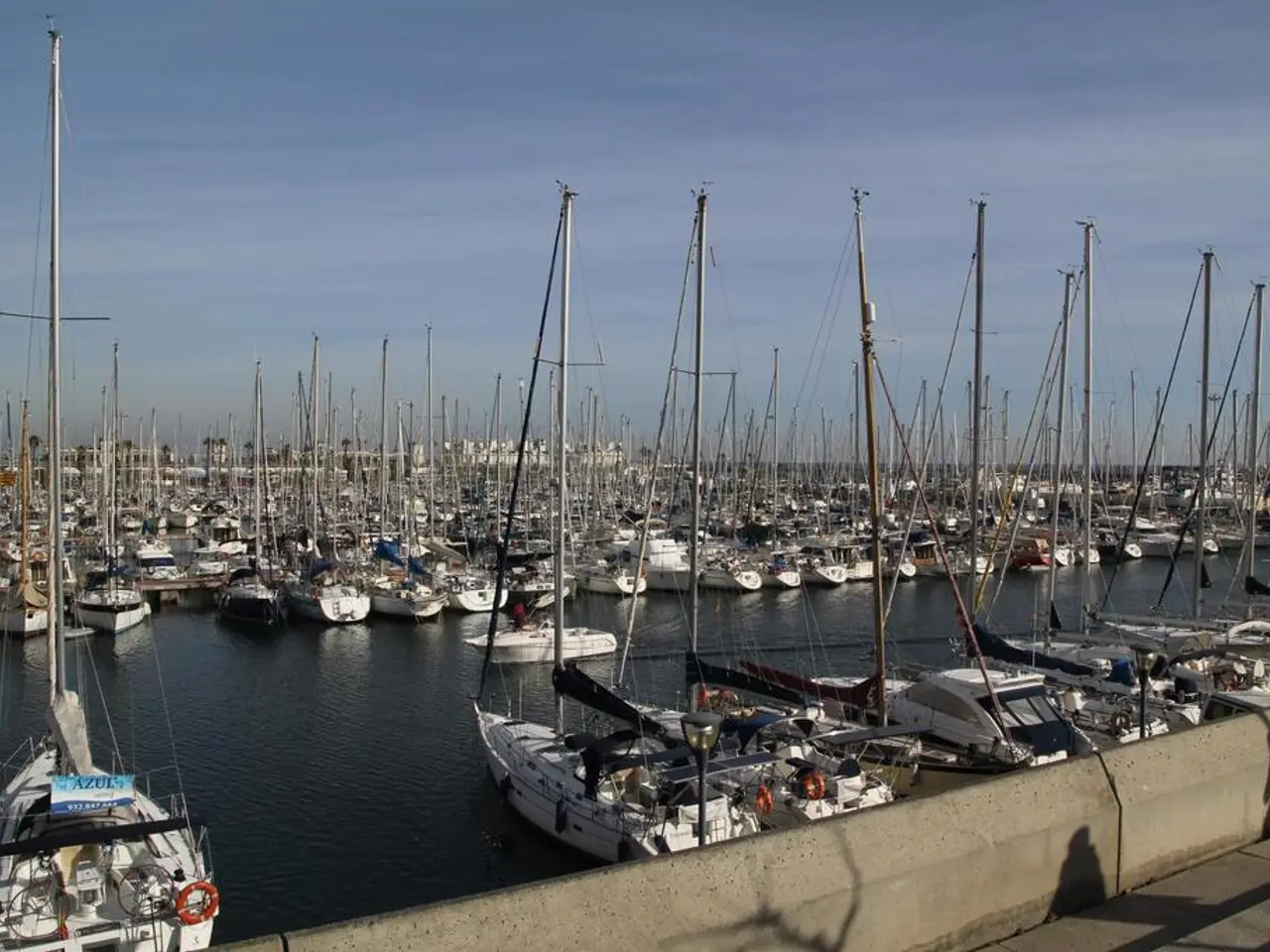 The picture is taken in a shipyard. In the foreground it is dock. In the center of the picture...