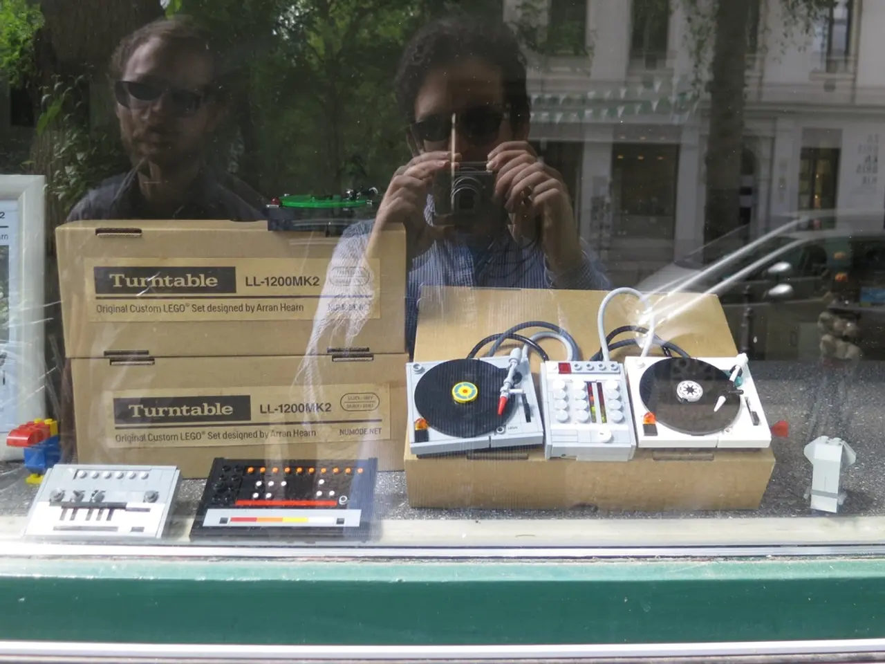 These are the electronic devices and the cardboard boxes, which are placed on the table. I think...