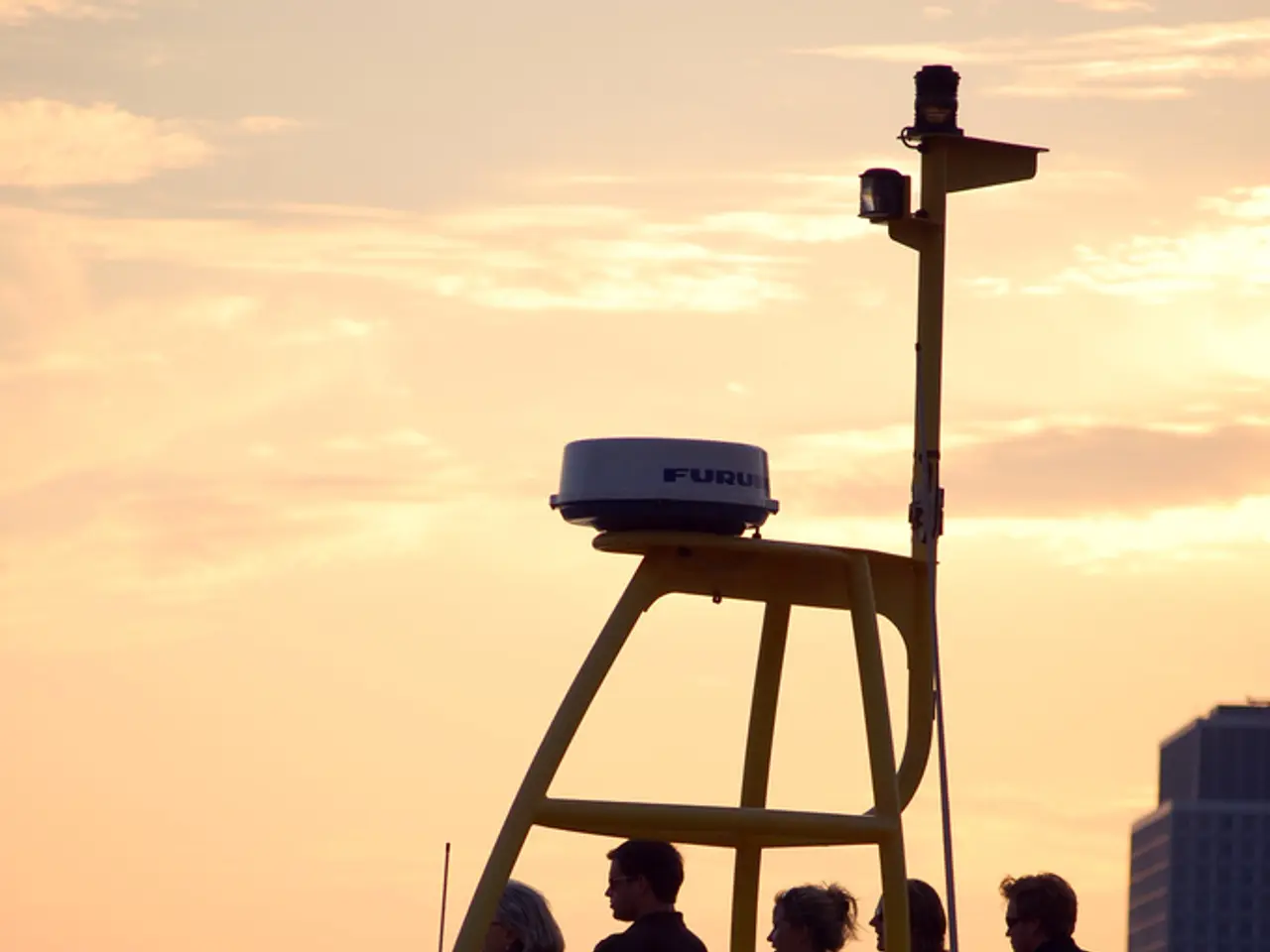 In this image there is a boat, people, digital board, water, buildings, cloudy sky and objects.