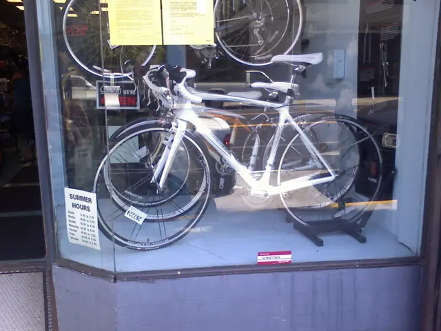 In the picture we can see some bicycles are placed in the show case which is covered with glass.