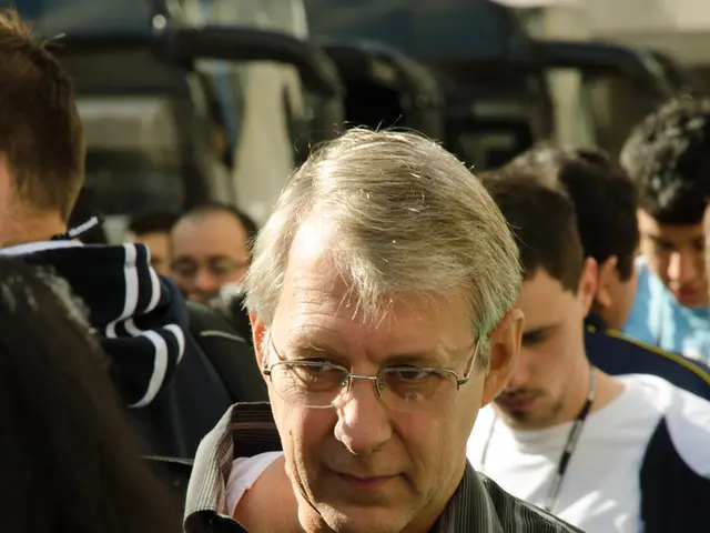 In the image there are few people, the first two men were wearing Microsoft id cards.