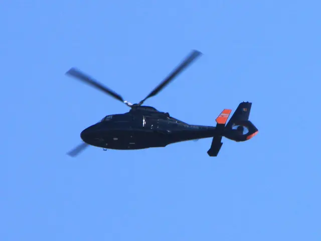 In this image we can see a helicopter is flying in the sky.