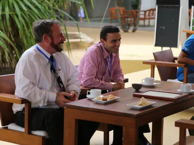 In the middle there is a table on that there is a plate , cup and saucer. On the left there is a...