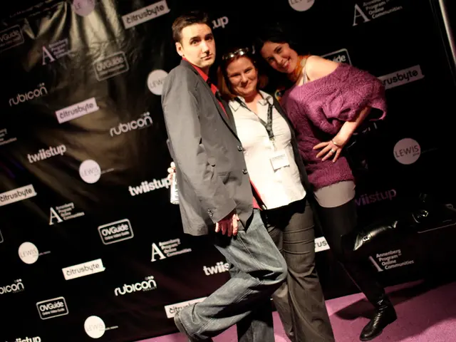 In the picture we can see a man and two women are standing together and man is in blazer, tie and...