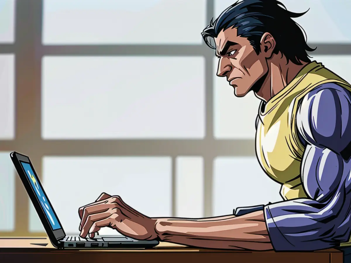 A financial backer enters data onto a computer.